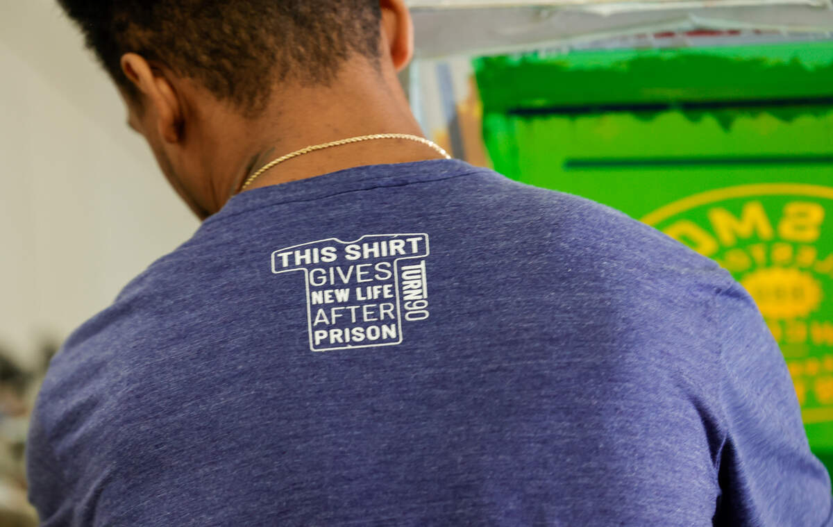 Tyrone Hollins works in the Turn 90 program screen printing shop. Turn 90 helps with the reentry process by helping formerly incarcerated men with life skills.