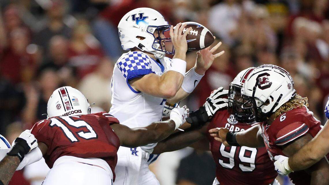 Kentucky Wildcats quarterback Will Levis (7) is stopped by South Carolina’s Aaron Sterling (15), Jabari Ellis (99) and Zacch Pickens (6) during a game at Williams-Brice Stadium on Sept. 25, 2021.