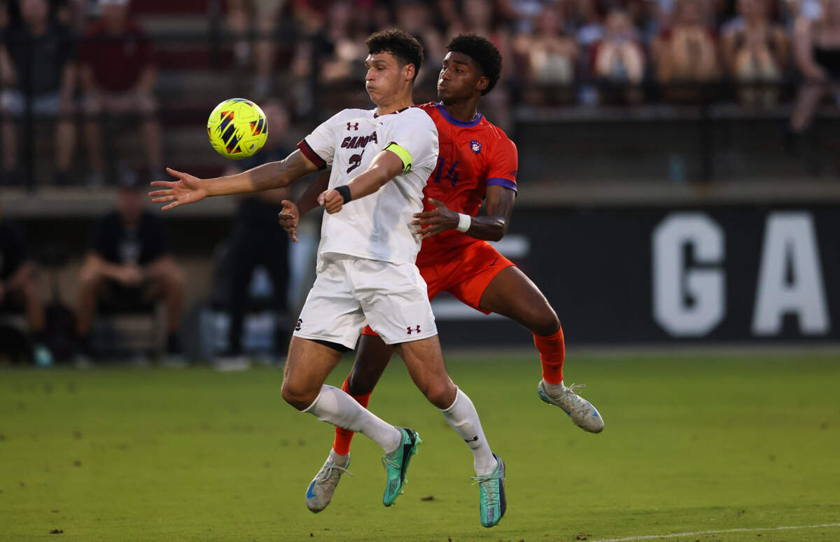 South Carolina forward Harrison Myring (23) and Clemson defender Titus Sandy Jr. (14) go up for a loose ball during the Gamecocks’ game against Tigers in Columbia on Friday, August 30, 2024.