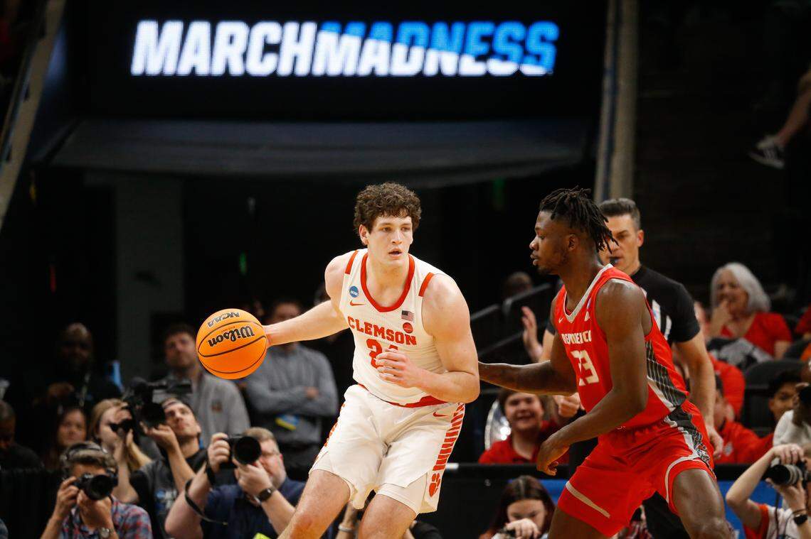 Clemson Tigers center PJ Hall (24) dribbles against New Mexico Lobos center Nelly Junior Joseph (23) during the NCAA Tournament first round game at FedExForum.