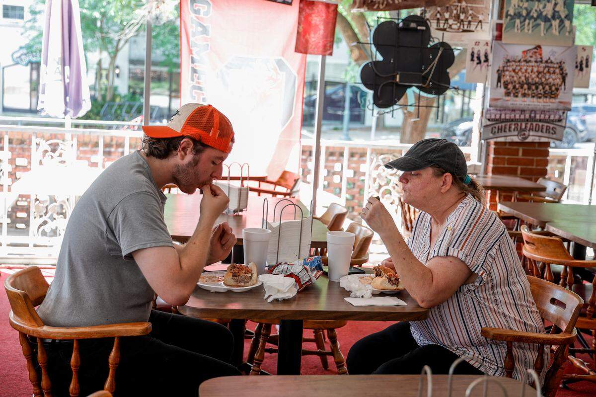 John and Patti Donohue enjoy an Andy’s Special sandwich during lunch at Andy’s Deli in Five Points.