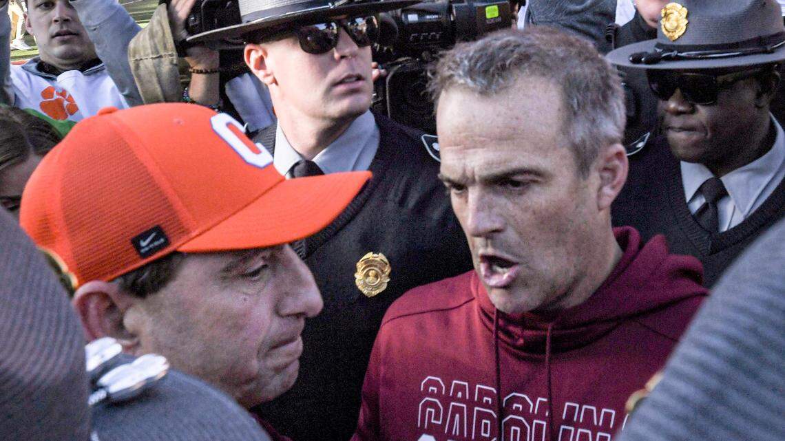 Nov 30, 2024; Clemson, South Carolina, USA; Clemson head coach Dabo Swinney and South Carolina Head Coach Shane Beamer talk after the game at Memorial Stadium.