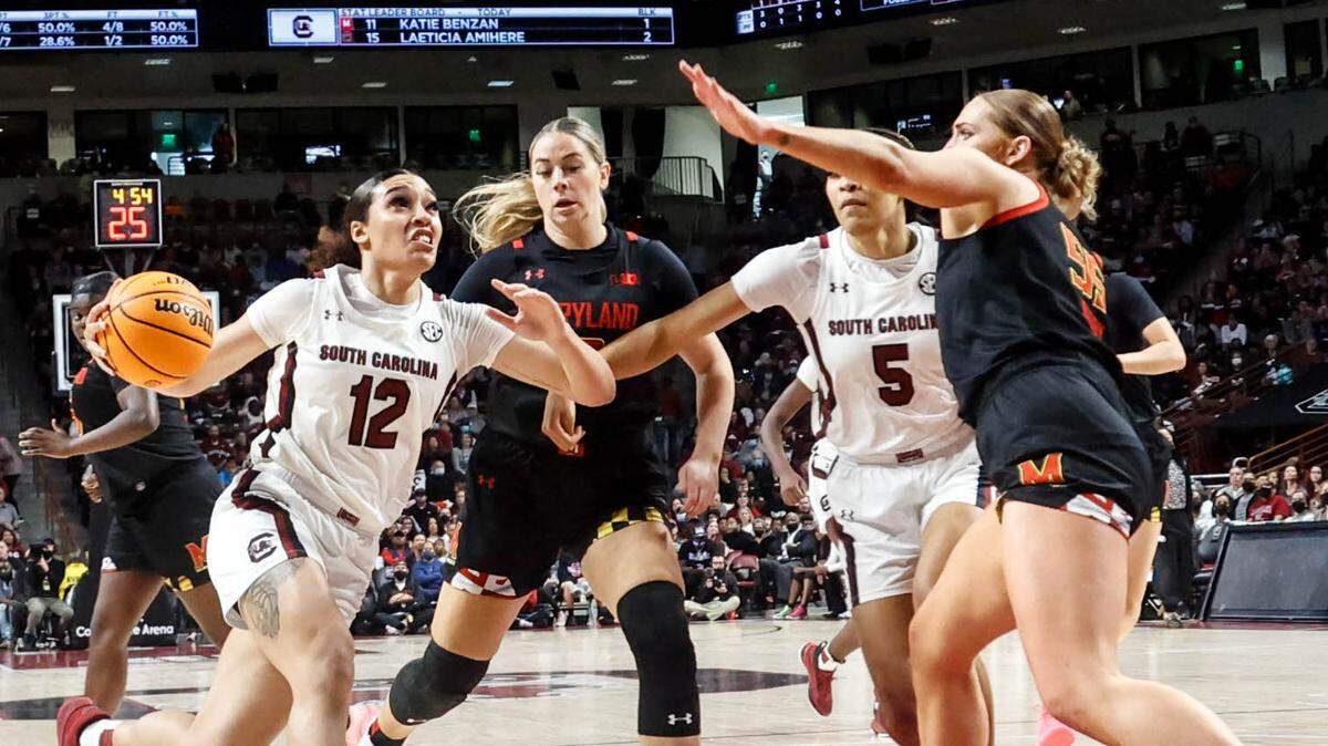 South Carolina’s Brea Beal (12) drives to the basket as Maryland’s Chloe Bibby (55) defends during the first half of action on Sunday, Dec. 12, 2021 in the Colonial Life Arena.