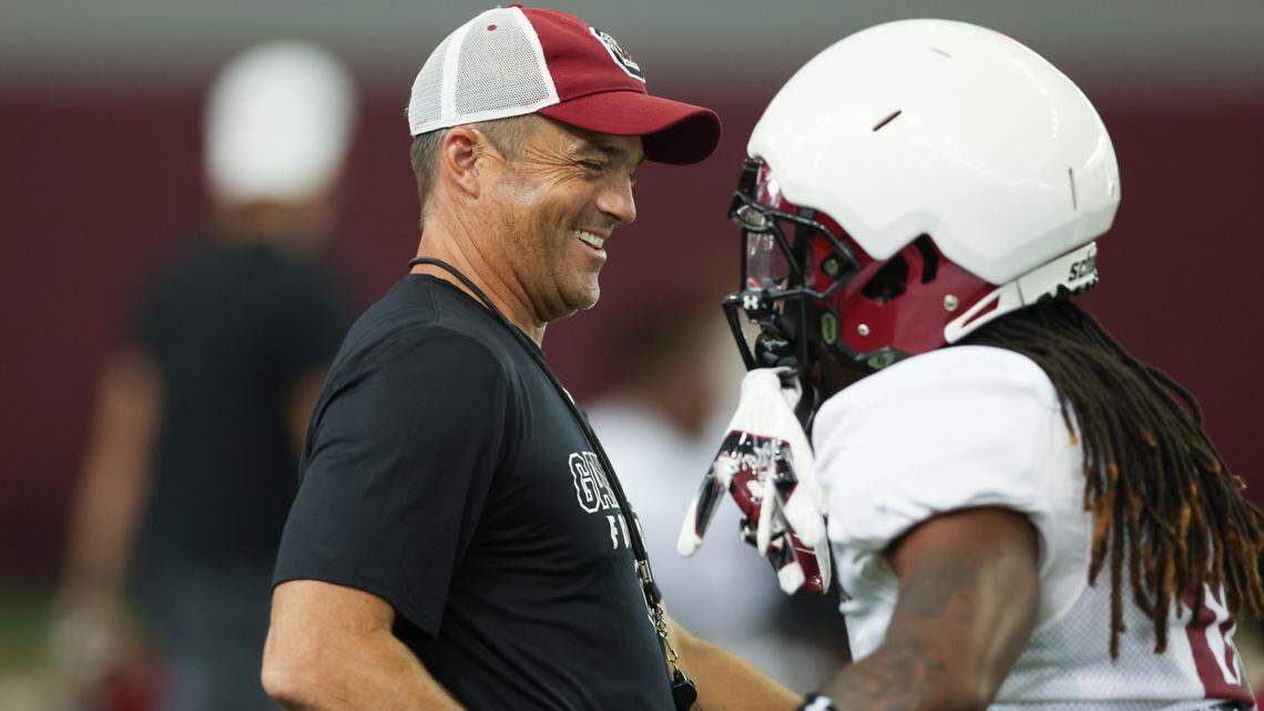 South Carolina head coach Shane Beamer greets running back Juju McDowell (0) runs drills during practice in Columbia on Sunday, August 11, 2024.