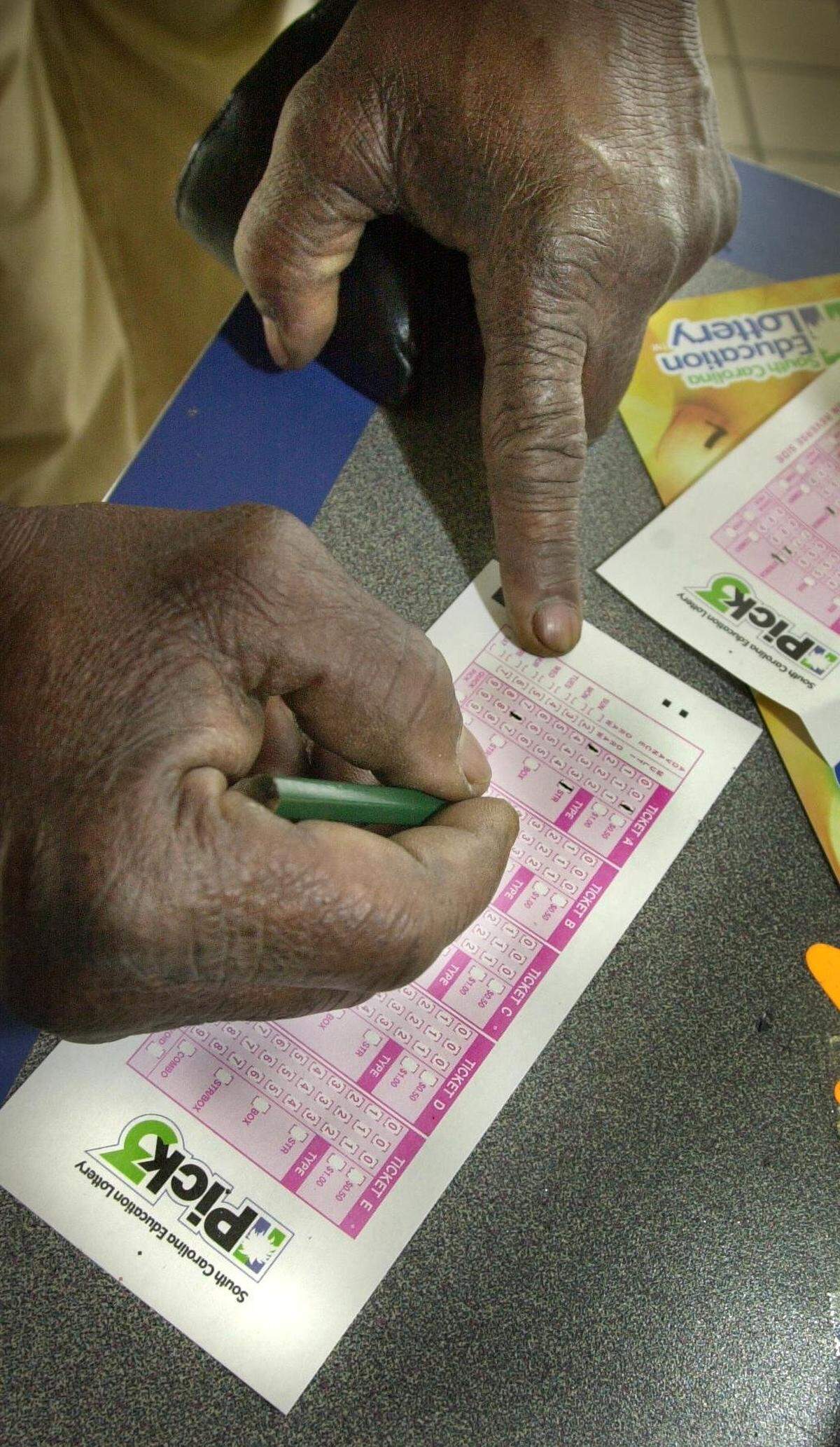 Thursday was the first day of the Pick 3 lottery tickets went onsale. Sales  were not as brisk as the first day of the scratch-off tickets.Many were  saying that the tickets were confusing. HERE> Charles Hughie fillsout his  ticket. He filled it out twice to get it correct.   PHOTO BY TIMDOMINICK     3/07/02