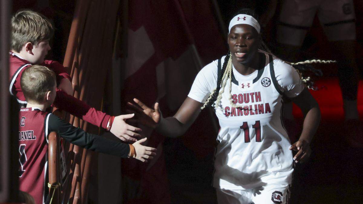 South Carolina's Madina Okot (11) greets fans during team introductions before their women's basketball game against North Carolina Central at Colonial Life Arena on Sunday, Dec. 7, 2025.