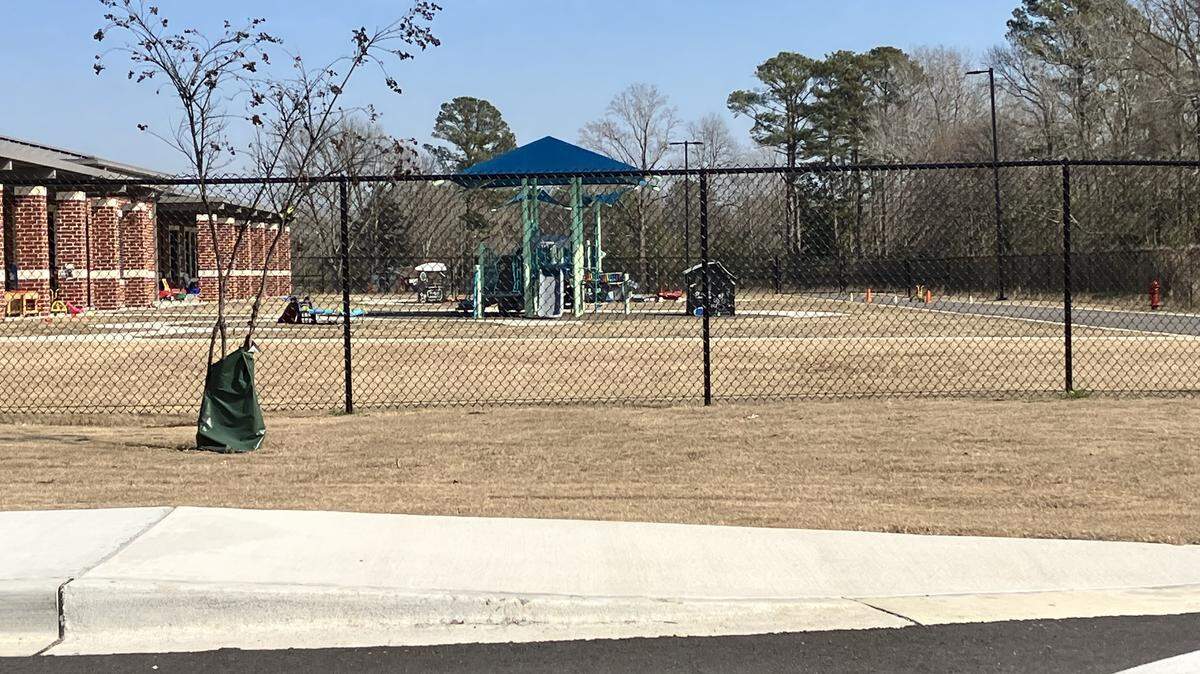 State and federal agencies are seeking to learn more about a polluting industry’s sludge that was reportedly spread long ago on land where Black Creek Elementary School was built. This a shot of the school’s playground in Darlington County.