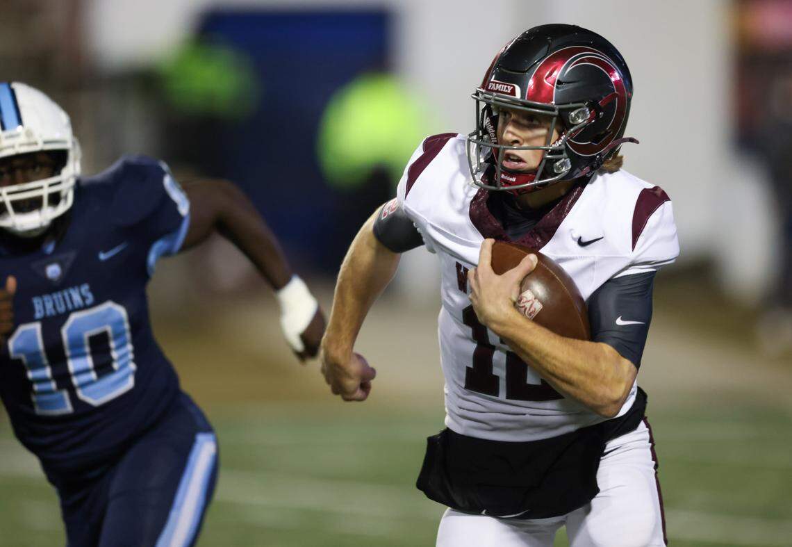 Westside quarterback Cutter Woods (12) carries the football during the Class 4A Football State Championships in Orangeburg on Friday, December 13, 2024.