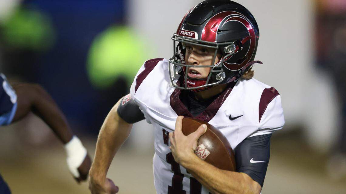 Westside quarterback Cutter Woods (12) carries the football during the Class 4A Football State Championships in Orangeburg on Friday, December 13, 2024.