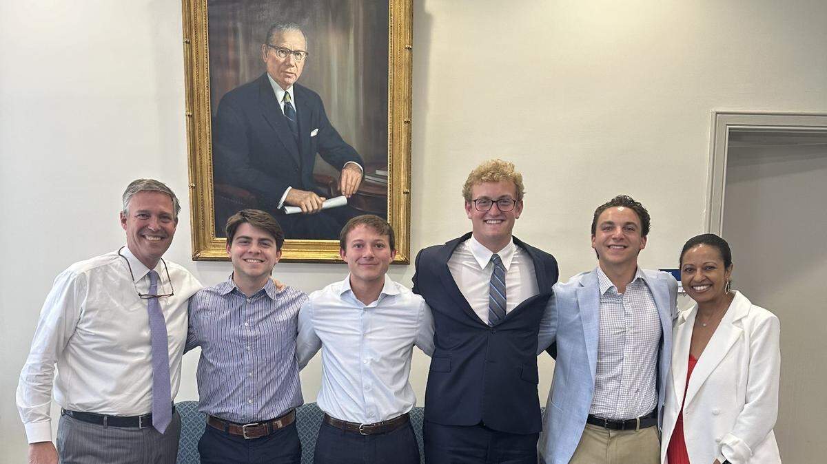 Columbia Mayor Daniel Rickenmann and City Manager Teresa Wilson stand on either side of four people from Shaw Circle Management, left to right, Jack Oberman, Jordan Fowler, Ryan Henry and Carter Burns.