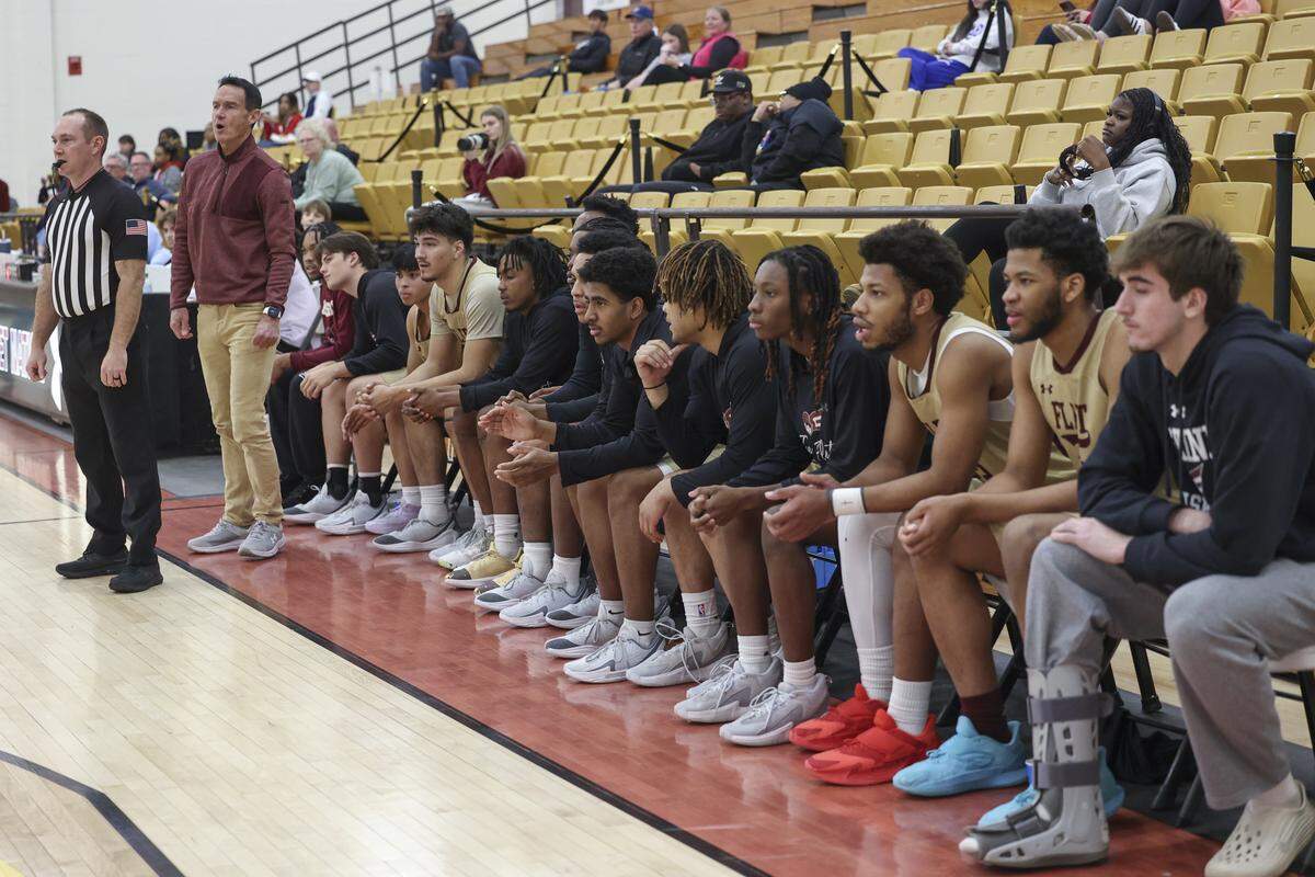Erskine coach Mark Peeler coaches a game as fourteen players sit on the bench during an Erskine College basketball game on  Wednesday, Jan. 21, 2026. Erskine fields two developmental teams and a varsity team with a roster totaling 44 players. 