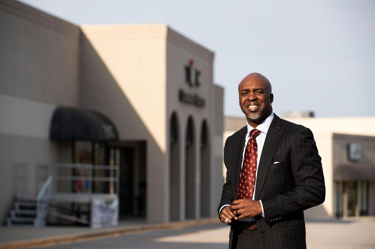 Bishop Eric Freeman of The Meeting Place Church of Greater Columbia posses for a portrait in front of his church near Two Notch Road on Tuesday, April 12, 2022. His church owns the strip mall that houses his church, and uses that space to partner with other organizations aligned with the church’s mission.