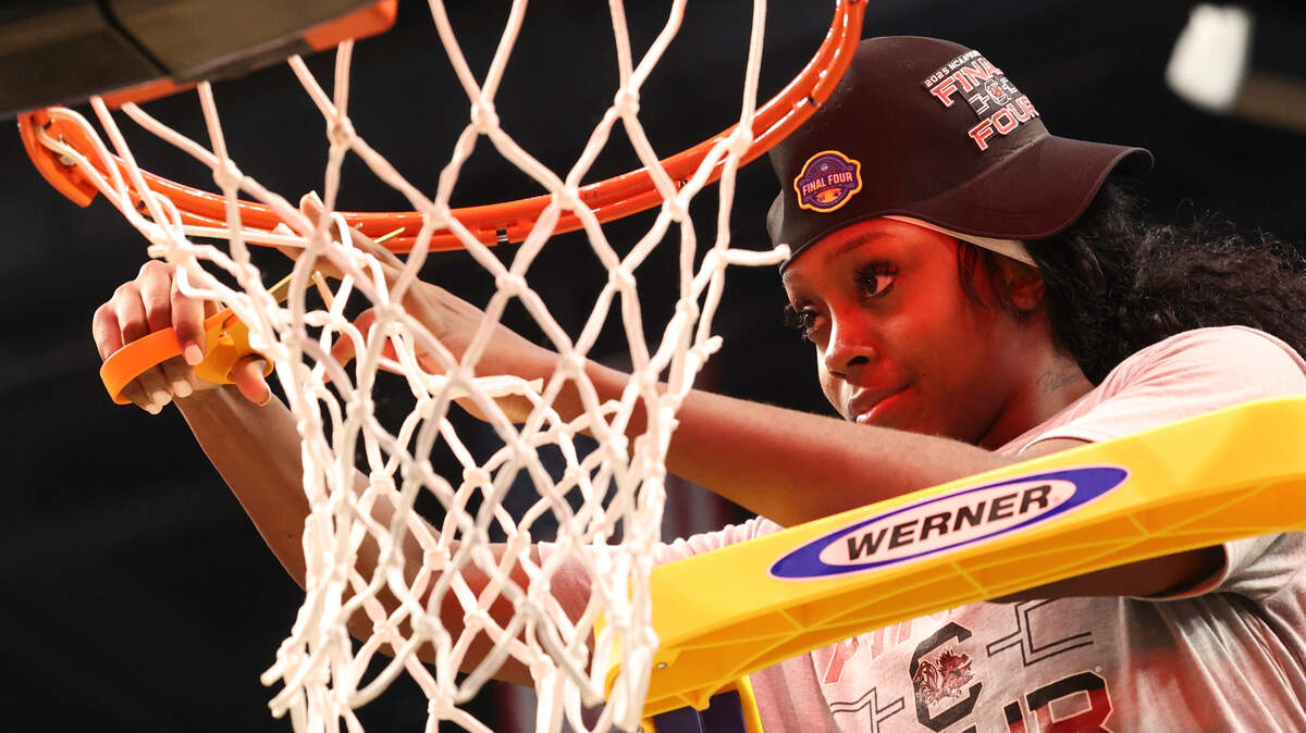 University of South Carolina’s Raven Johnson (25) cuts the net after The Gamecocks beat Duke to advance to the Final Four round of the NCAA Tournament at the Legacy Arena in Birmingham on Sunday, March 30, 2025.