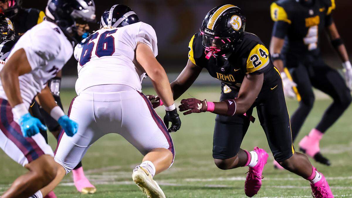 Irmo Yellow Jackets DL Jaiden Bryant (24) rushes the passer during the game between the White Knoll Timberwolves at the Irmo Yellow Jackets, Friday night, 10/17/25.