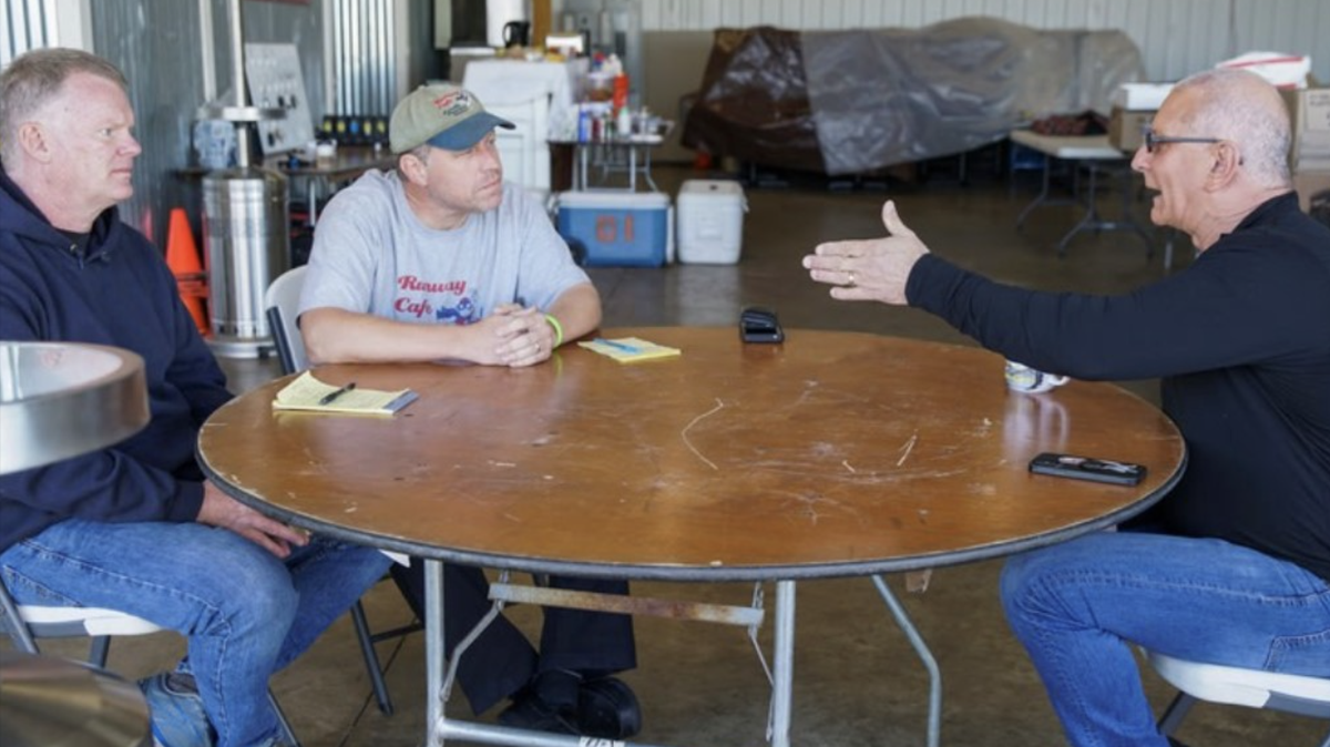 Runway Cafe owners, Lem Winesett, left, and Mike Bliss, meet with Robert Irvine of Restaurant Impossible.