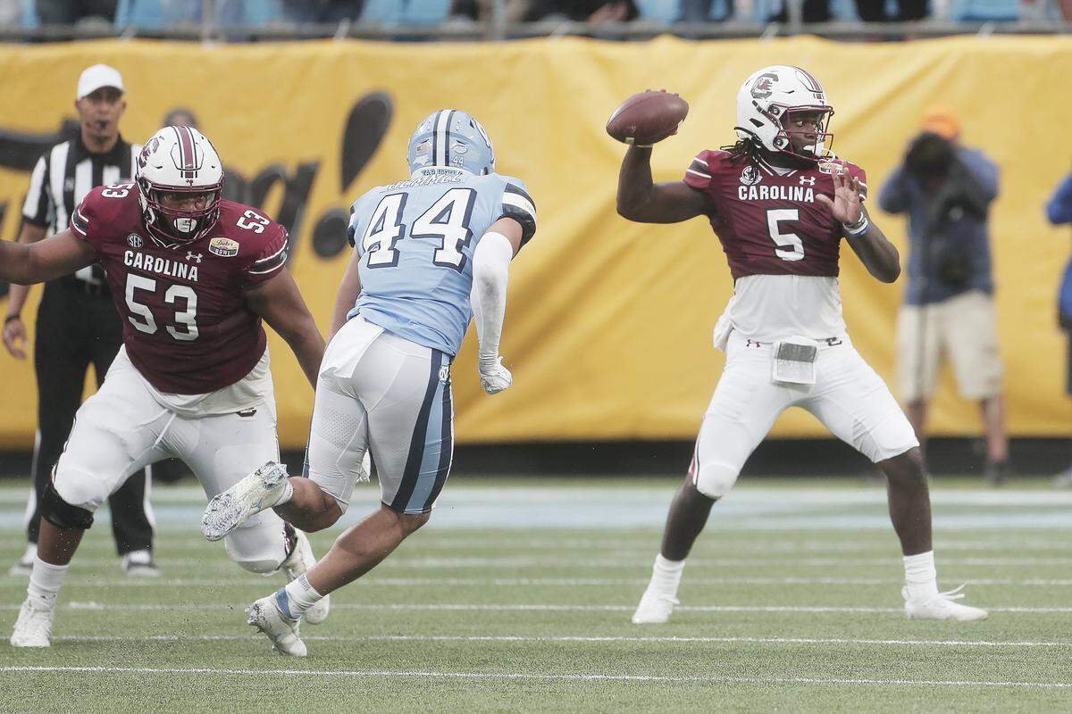 South Carolina quarterback Dakereon Joyner (5) passes the ball during the game against North Carolina at the Duke’s Mayo Bowl at Bank of America Stadium in Charlotte on Dec. 30, 2021. 