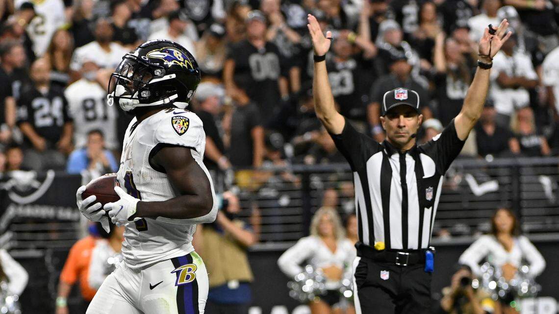 Baltimore Ravens running back Ty’Son Williams (34) scores a touchdown against the Las Vegas Raiders during the first half of an NFL football game, Monday, Sept. 13, 2021, in Las Vegas. (AP Photo/David Becker)
