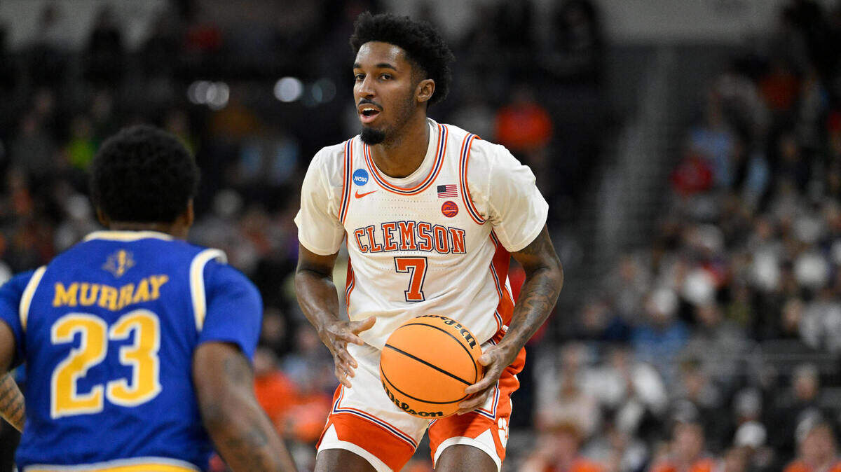 Mar 20, 2025; Providence, RI, USA; Clemson Tigers forward Chauncey Wiggins (7) controls the ball against McNeese State Cowboys guard Brandon Murray (23) during the first half at Amica Mutual Pavilion.