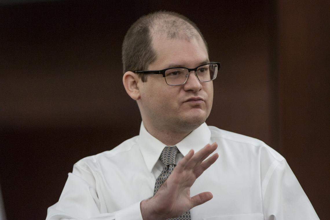 Tim Jones waves to his family during his trial in Lexington. 5/22/19