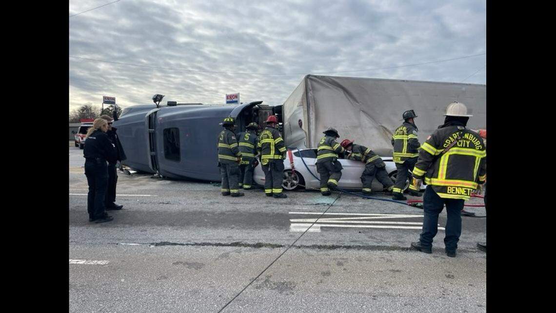 The sports car driver was freed more than an hour after the South Carolina crash, officials said.