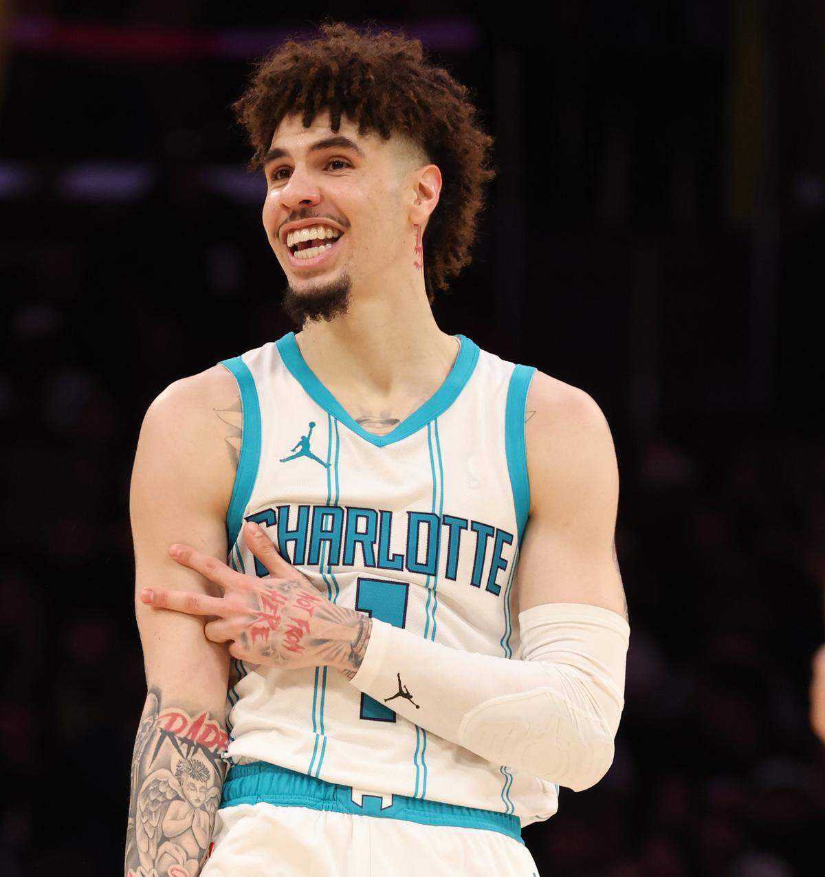 Feb 19, 2025; Los Angeles, California, USA; Charlotte Hornets guard LaMelo Ball (1) reacts after a basket during the fourth quarter against the Los Angeles Lakers at Crypto.com Arena.