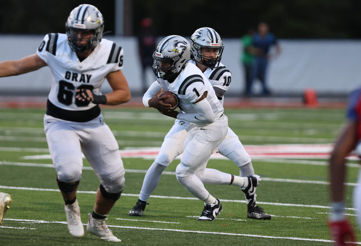 BJ Montgomery (1) of Gray Collegiate takes a handoff from John Tyler Waller (10) during Hammond’s game against visiting Grey Collegiate on Friday, September 1, 2023.