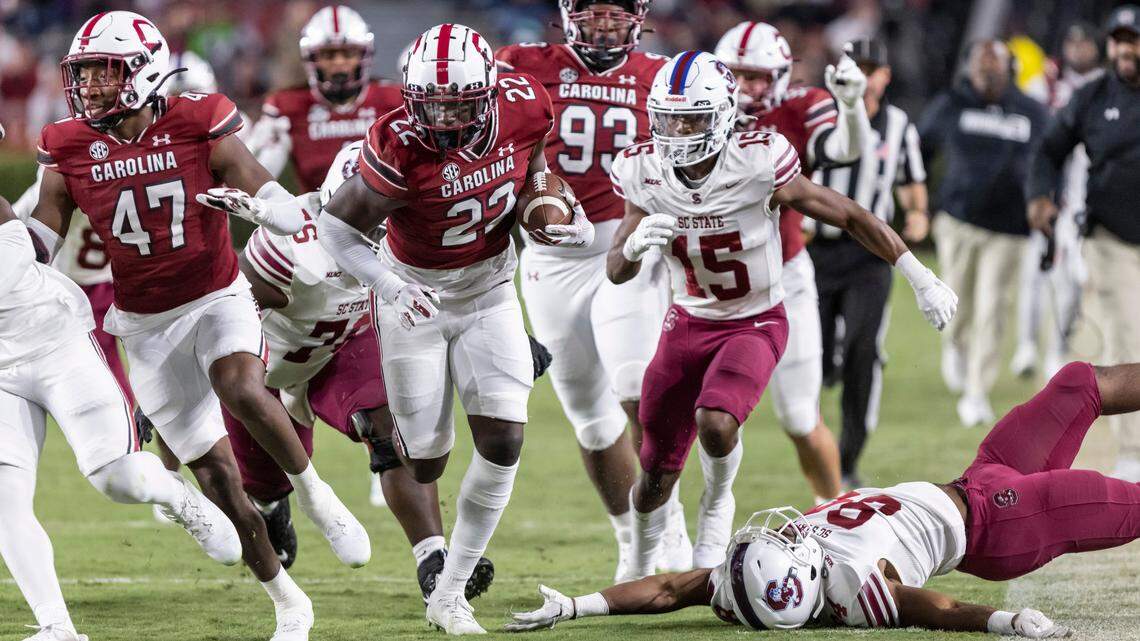 South Carolina Gamecocks linebacker Bam Martin-Scott (22)runs over South Carolina State Bulldogs wide receiver Jakari Williams (84) after a turnover at Williams-Brice Stadium in Columbia, SC on Saturday, Sept. 29, 2022.