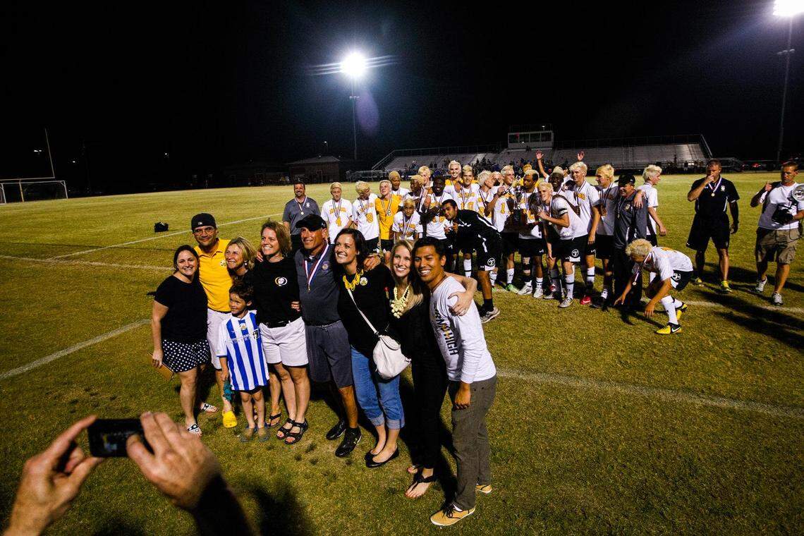 The family of Irmo’s head coach Phil Savitz and the Irmo soccer team pose after winning the Class 4A Boys Soccer State Championship Saturday night in Gilbert. Irmo defeated Lexington 1-0 in a shootout.