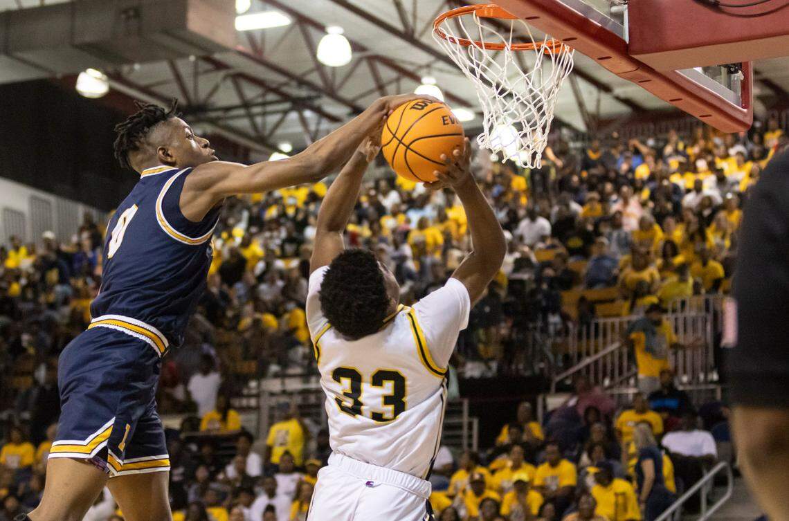 Lancaster’s Jordan Watford blocks a shto by Irmo’s Aaron Brand Jr. during the SCHSL playoffs in March.