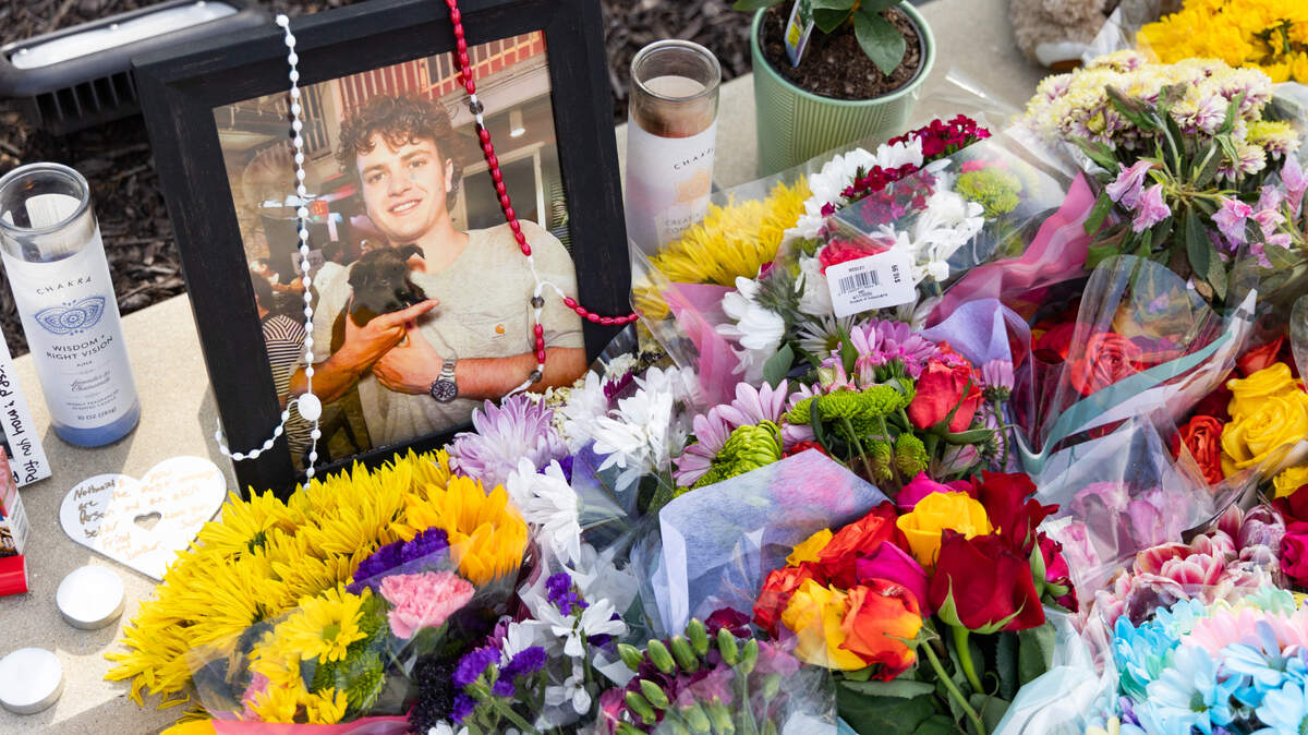 South Carolina students leave messages and flowers at a memorial for South Carolina student Nate Baker, who died after a hit-and-run crash on the intersection of Blossom Street and Assembly Street on Friday, April 4, 2025.