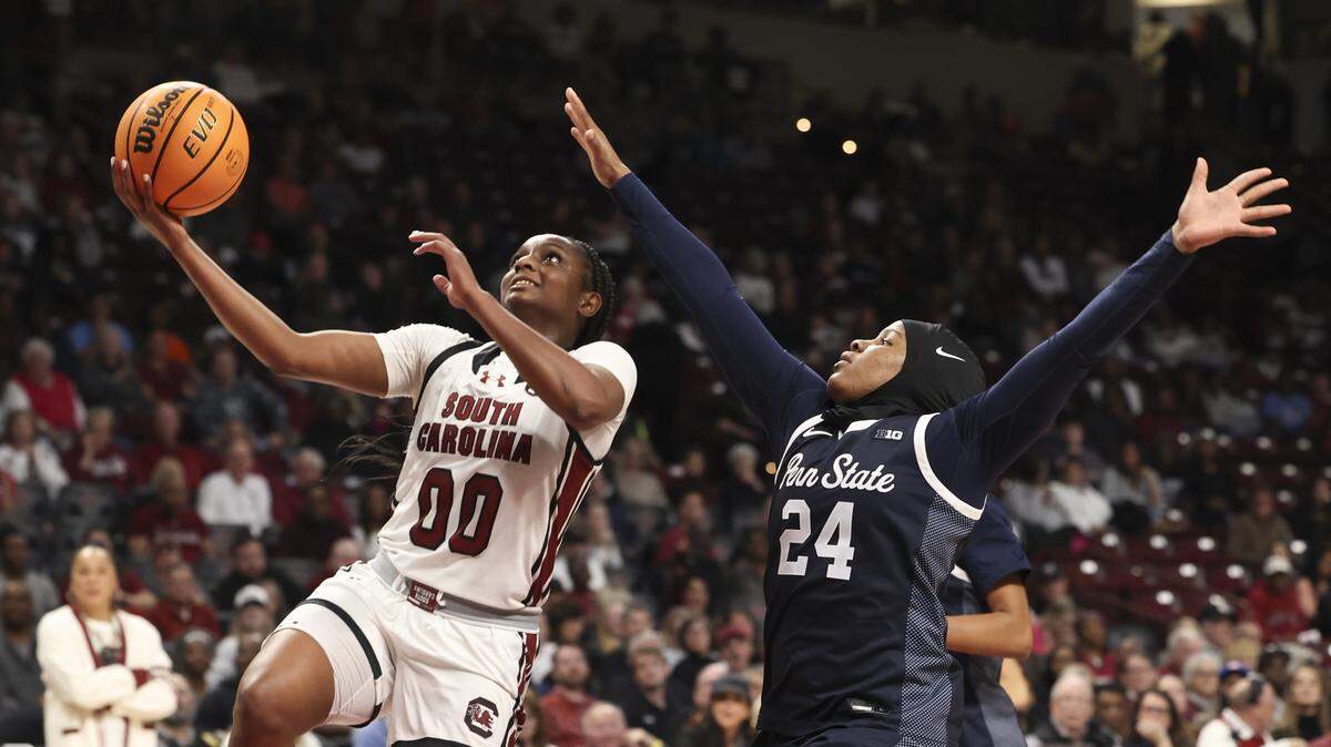South Carolina's Ta'Niya Latson (00) drives to the basket as Penn State's Shayla Smith (24) pressures during the second half of action of their women's basketball game against Penn State at Colonial Life Arena on Sunday, Dec. 14, 2025.