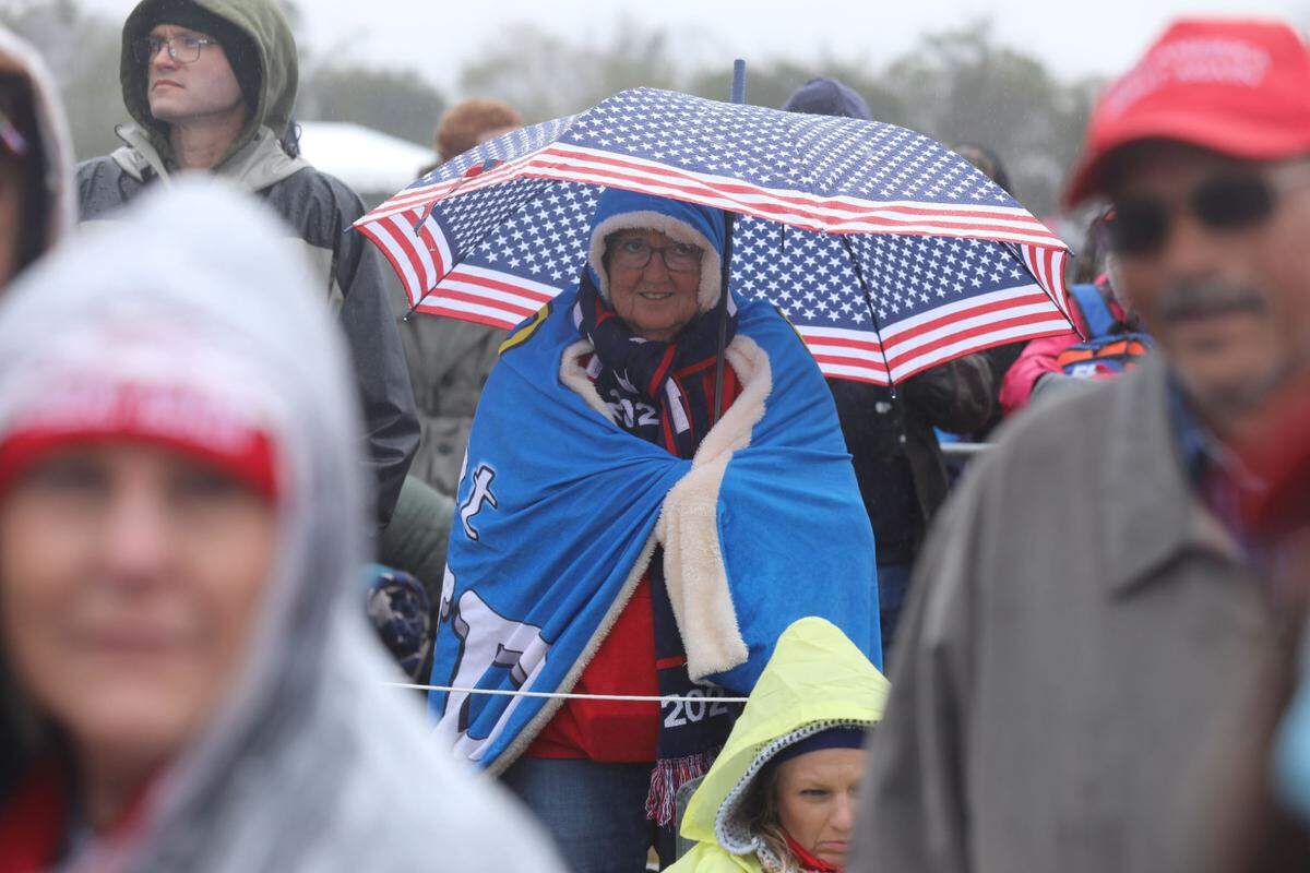Supporters gather hours ahead of former President Donald Trump’s rally in Florence, S.C., on Saturday, March 12, 2022.