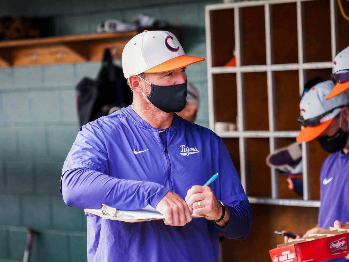 Clemson baseball coach Monte Lee wears his mask during one of the Tigers’ preseason scrimmages.