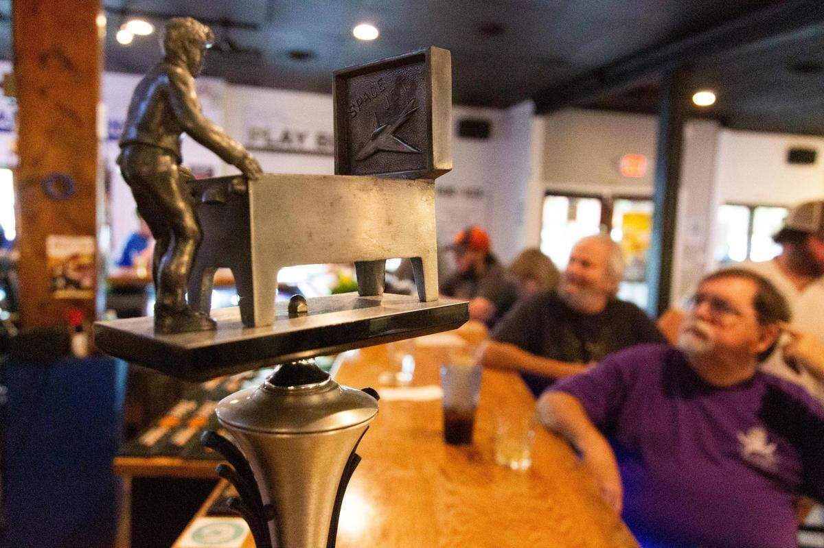 Frederick Richardson’s trophy for winning the Papa 3 International Championship Doubles competition in 1993 on display at the Bang Back Pinball Lounge on Thursday, July 15, 2021. He has taken his success as a competitive player to establish pinball businesses across the country.