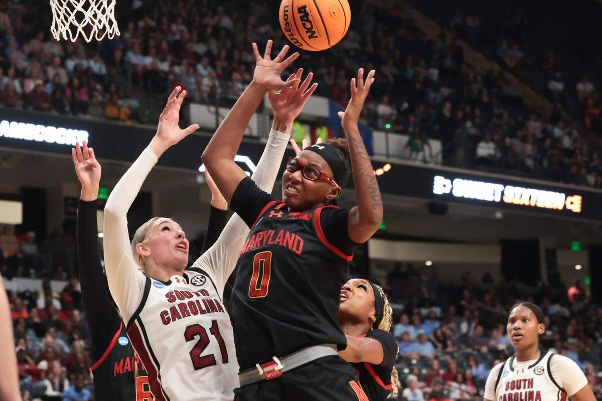 University of South Carolina’s Chloe Kitts (21) goes for a rebound with Maryland Terrapins’ Shyanne Sellers (0) during the first half of action at the Legacy Arena in Birmingham on Friday, March 28, 2025 in the Birmingham 2 regional of the NCAA Tournament.