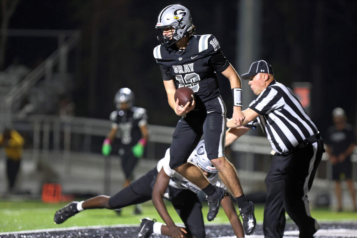 Gray Collegiate quarterback Tyler Waller scores a rushing touchdown in Tuesday’s game against Brookland-Cayce.