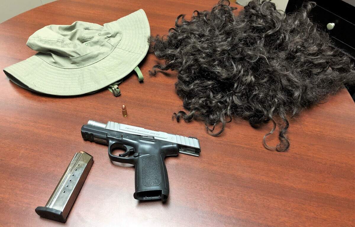 Picture of a wig, hat, and gun that the Greenville Police say is believed to have been used by bank robbing suspect Preston Emmanuel Hancock.