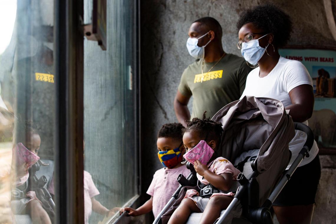 Brianna Wakefield, Nicholas Wakefield and their children Roman, 4, and Isla, 1, look at a grizzly bear at the Riverbanks Zoo and Garden on Friday, June 26, 2020. The zoo already had a mask policy in place before the city mandated public mask use,