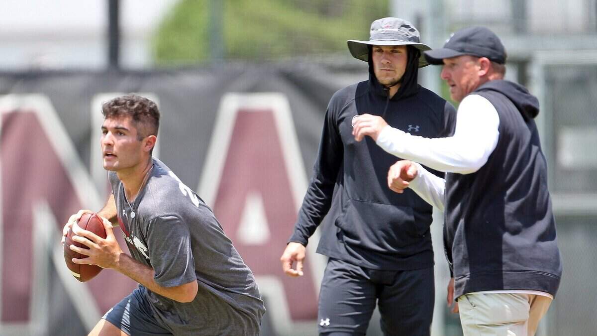 From June 9: South Carolina quarterback recruit Dante Reno (Class of 2024) works out with Gamecock QB Luke Doty and offensive coordinator Marcus Satterfield at the Shane Beamer Football Camp held Thursday, June 9, 2022.