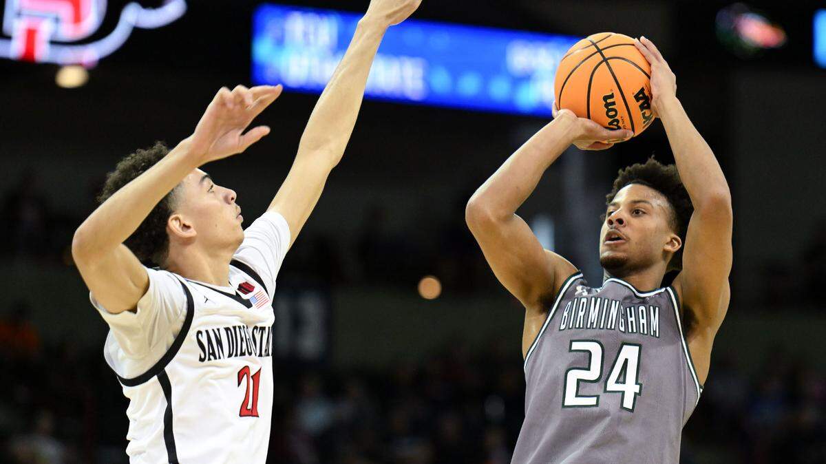 Mar 22, 2024; Spokane, WA, USA; UAB Blazers guard Efrem Johnson (24) attempts a basket against San Diego State Aztecs guard Miles Byrd (21) during the second half in the first round of the 2024 NCAA Tournament at Spokane Veterans Memorial Arena. Mandatory Credit: James Snook-USA TODAY Sports