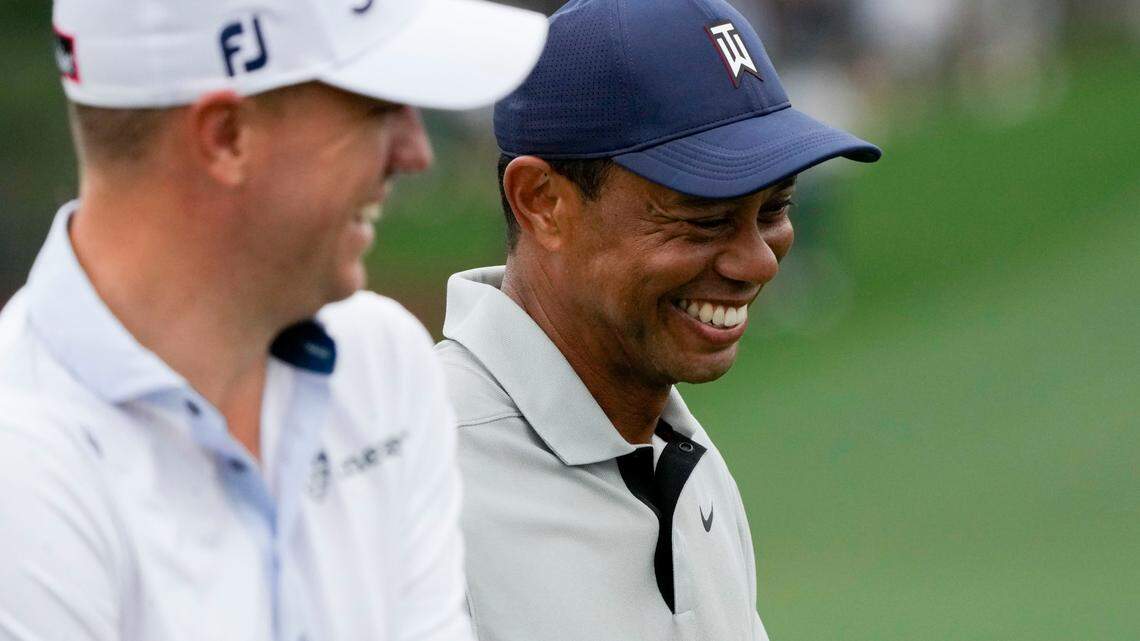 Justin Thomas and Tiger Woods share a laugh as they walk off the seventh green during Tuesday’s practice round for The Masters golf tournament at Augusta National Golf Club.