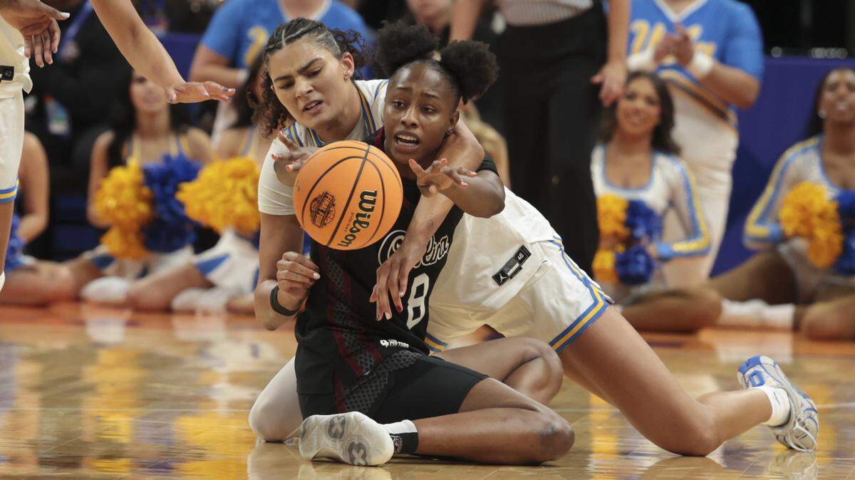 South Carolina's Joyce Edwards (8) fights with UCLA’s Lauren Betts (51) for a loose ball during the second half of action of their women's basketball game for the NCAA national championship against UCLA at Mortgage Matchup Center in Phoenix on Sunday, April 5,2026.