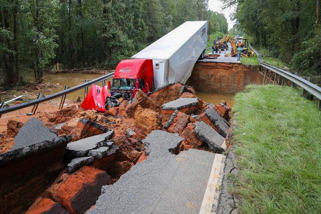 An 18-wheeler plunged into a washed-out portion of Highway 145 in Chesterfield County in South Carolina. The driver was not injured, according to the sheriff’s department. Floodwaters from Hurricane Florence washed the road out. The wreck occurred around 6:30 a.m. Monday, neighbors said.
