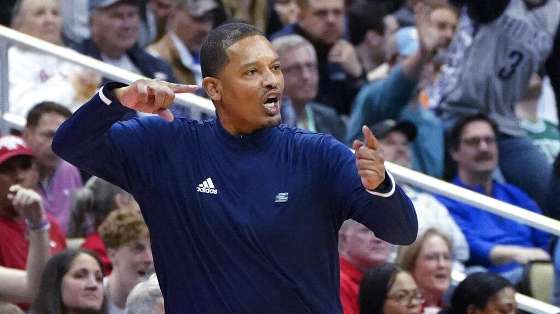 Chattanooga coach Lamont Paris gestures after the ball went out of bounds on a bad pass against Illinois during the second half of a college basketball game in the first round of the NCAA men’s tournament Friday, March 18, 2022, in Pittsburgh.