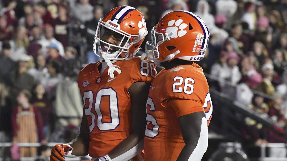 Clemson’s Beaux Collins, left, and Phil Marah celebrate Collins’ second-half touchdown against Boston College during an NCAA college football game Saturday, Oct. 8, 2022, in Boston. (AP Photo/Mark Stockwell)