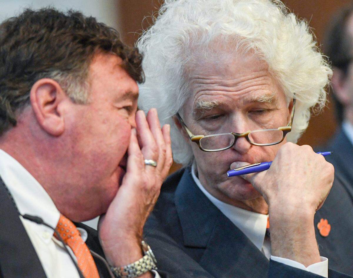 Clemson lawyer David Dukes, left, talks with fellow university lawyer Rush Smith III, right, during a hearing about Clemson and the ACC, Judge Perry H. Gravely presiding, at the Pickens County Courthouse in Pickens, S.C. Friday, July 12, 2024C.