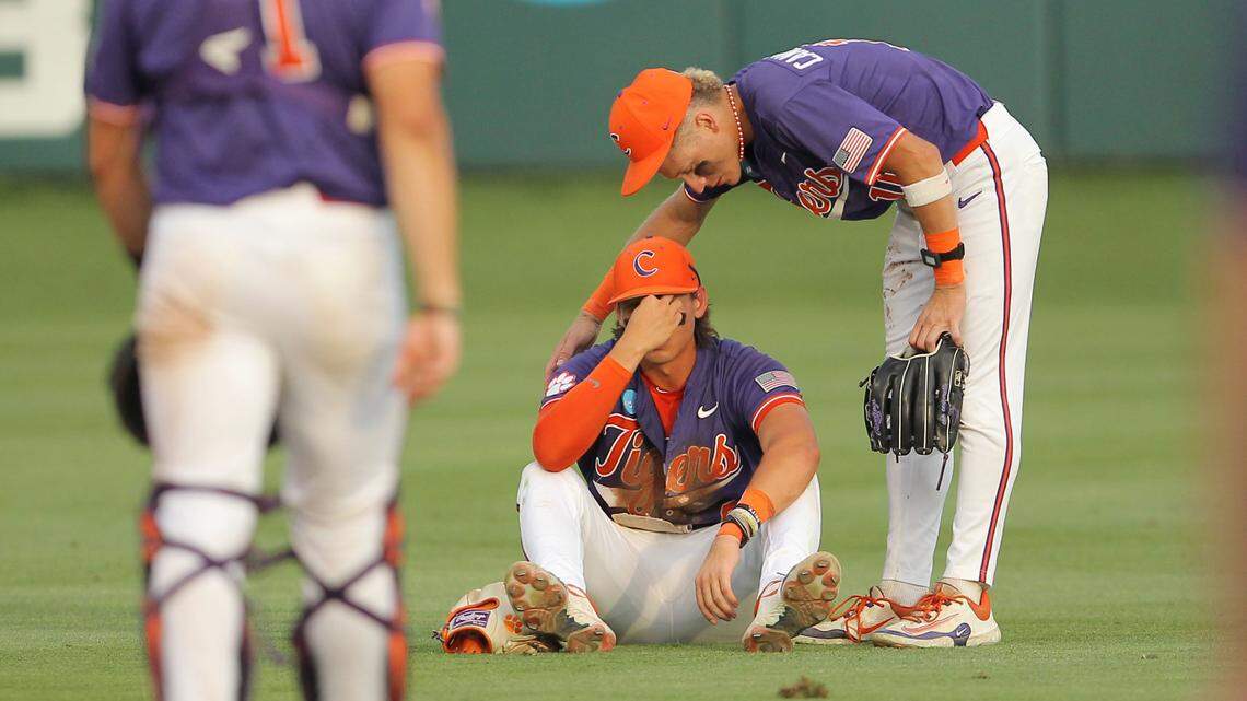 Clemson’s Jacob Hinderleider, bottom, and Clemson’s Cam Cannarella react to their loss to Florida following NCAA Super Regionals action on Sunday, June 9, 2024 in Clemson, S.C.