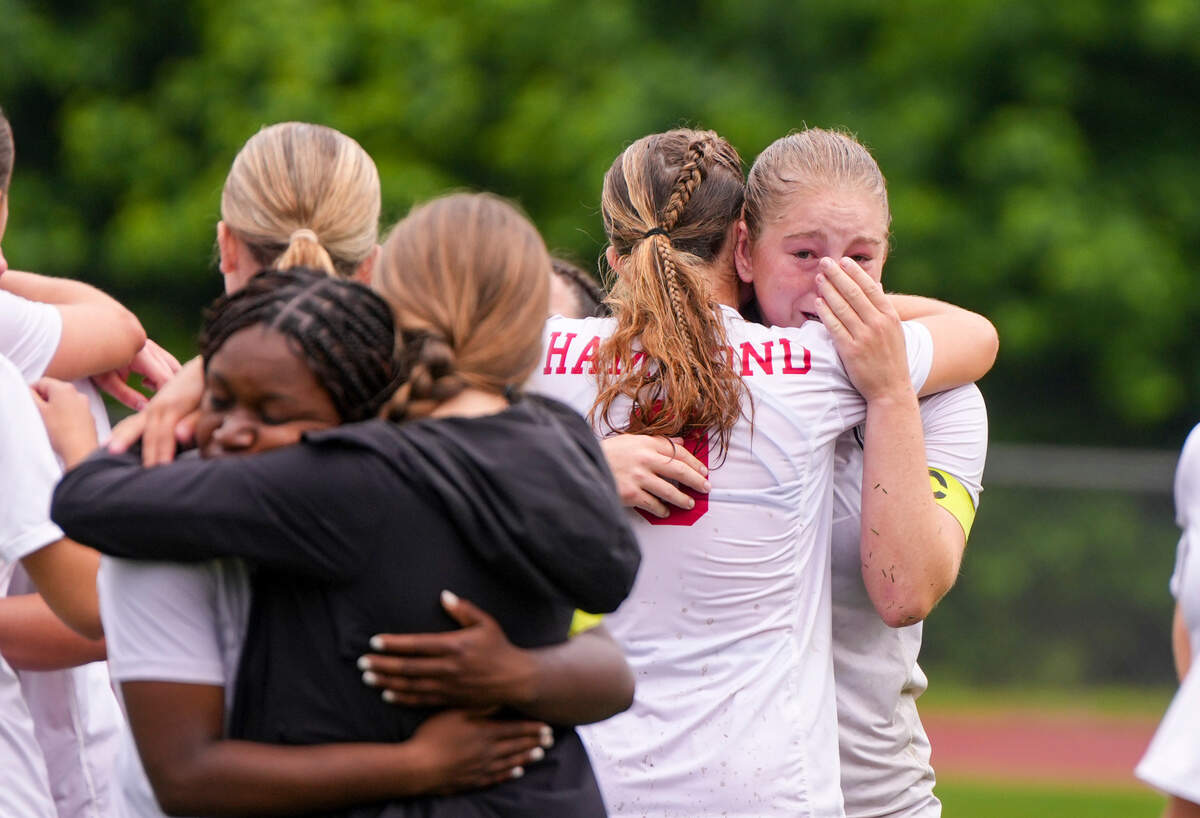 Elle Brewer (left) is comforted by AC Sanders after Hammonds loss to Porter Gaud during the SCISA Class 4A State Girls Soccer Championship game on May 10, 2025 in Columbia, South Carolina