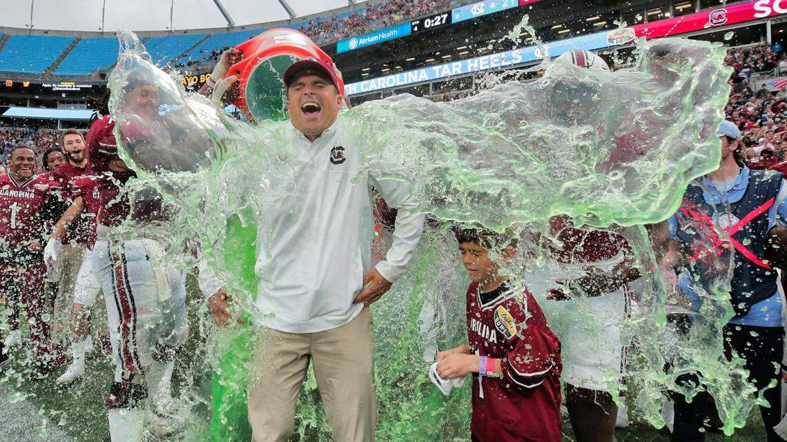 South Carolina Gamecocks head coach Shane Beamer is doused with Gatorade shortly before his team defeated North Carolina at the Duke’s Mayo Bowl at Bank of America Stadium in Charlotte, North Carolina on Thursday, December 30, 2021.