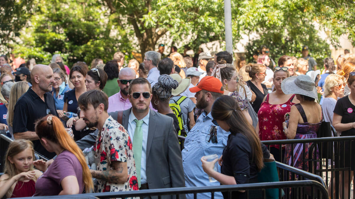 People in support and against banning abortion wait to enter the Solomon Blatt Building at the South Carolina State House before a hearing on Thursday, July 7, 2022.